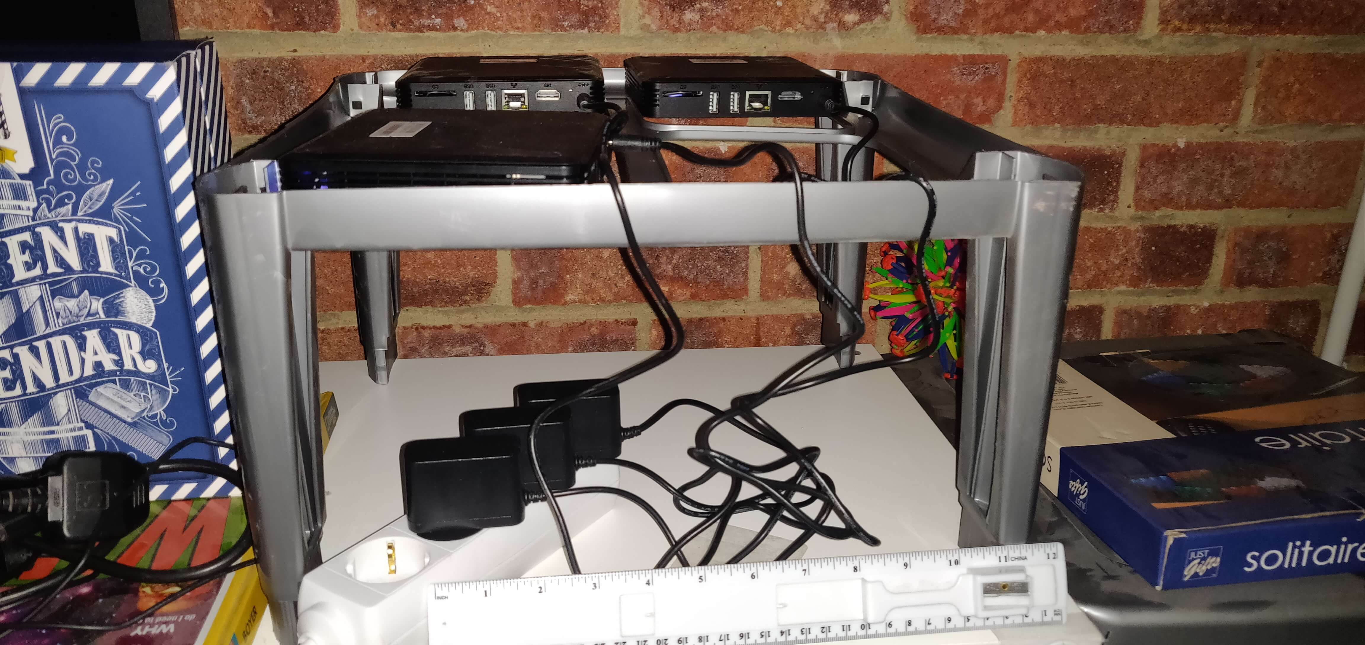 The first Pokemon Go scanning setup. Showing 3 T95's plugged in using European plugs balanced on a plastic frame.